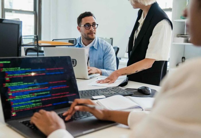 Three technology professionals working